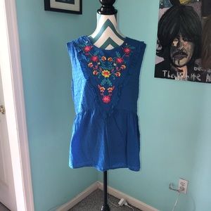 Adorable embroidered peplum sleeveless blouse
